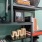 Detail of a model living room at our apartments for rent in Raleigh, NC, featuring black book shelves with frames and books.