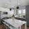 a kitchen with grey cabinets