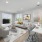 a living room with a couch and chairs