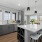 a kitchen with grey cabinets