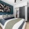 bedroom with a large window and modern decor
