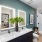Model bathroom at our apartments for rent in Raleigh, NC, featuring white countertops and black cabinetry.