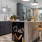 Model kitchen at our apartments for rent in Raleigh, NC, featuring wood grain flooring and a kitchen island.