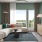 a living room with a couch and a fan